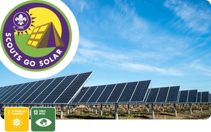 Scouts Go Solar Badge, with solar panels in a field in the background and UN SDGs 7 & 13 in the foreground